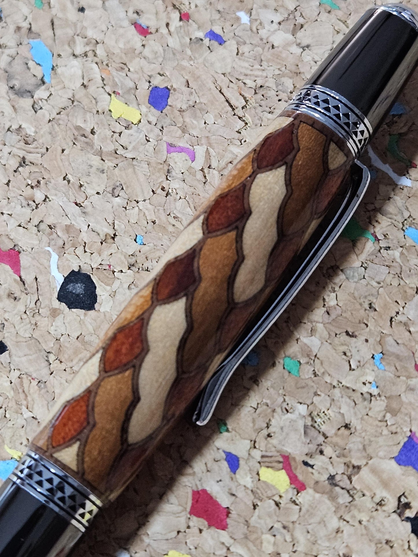 Cobb Brothers Scalloped Wooden Inlay Pen using Padauk, Mahogany, Maple, and Walnut Woods and Adorned with a Gunmetal and Chrome Pen Kit