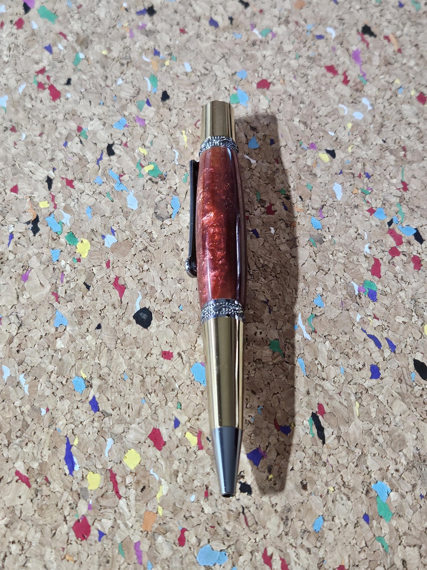 Red Swirled Resin Pen with Glitter and a Majestic Squire Inspired Gold Titanium and Rhodium Pen Kit with a Zirconium Gem on the Clip