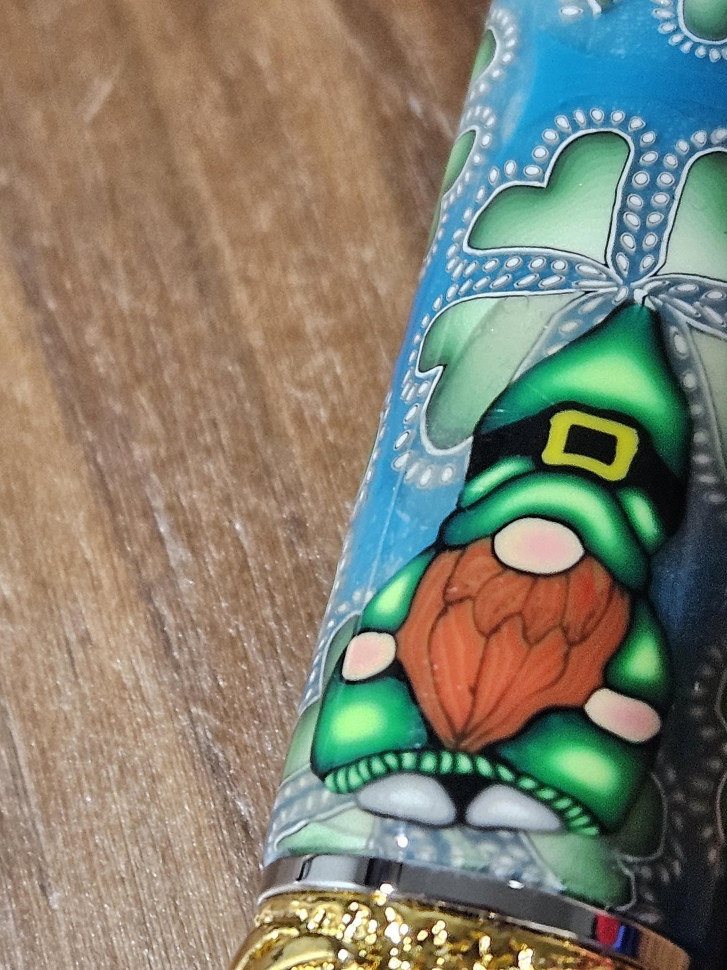 Polymer Clay Gnome Leprechaun Pen with Green Shamrocks, a Blue Background, Chrome and Gold Accents, and Featuring a Majestic Squire Pen Kit