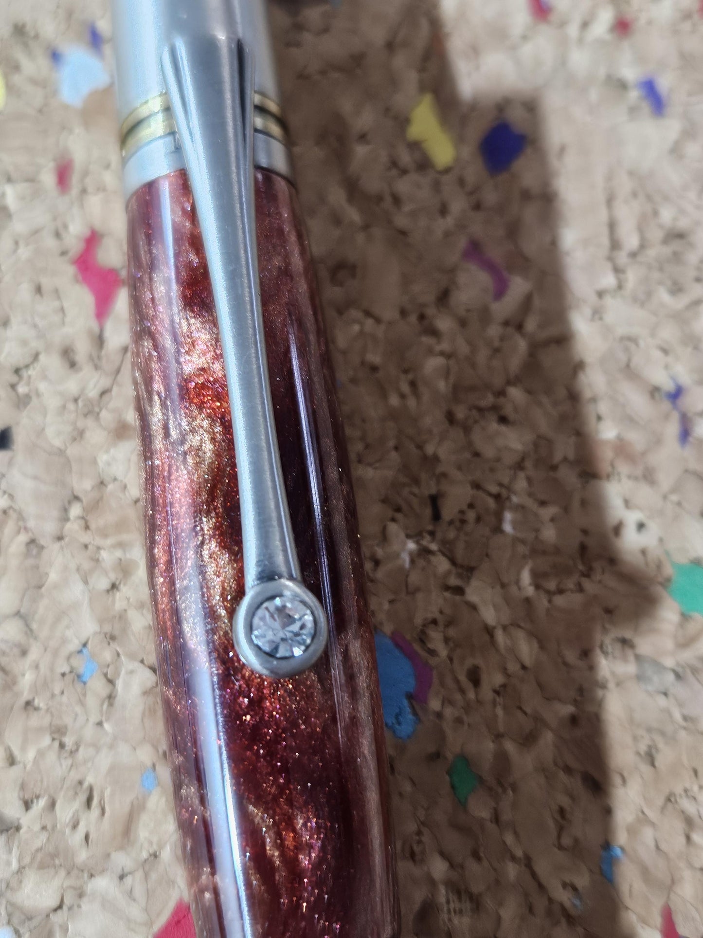 Red Swirled Resin Pen with Glitter and a Majestic Squire Pewter with an Antique Brass Pen Kit Adorned with a Zirconium Gem on the Clip