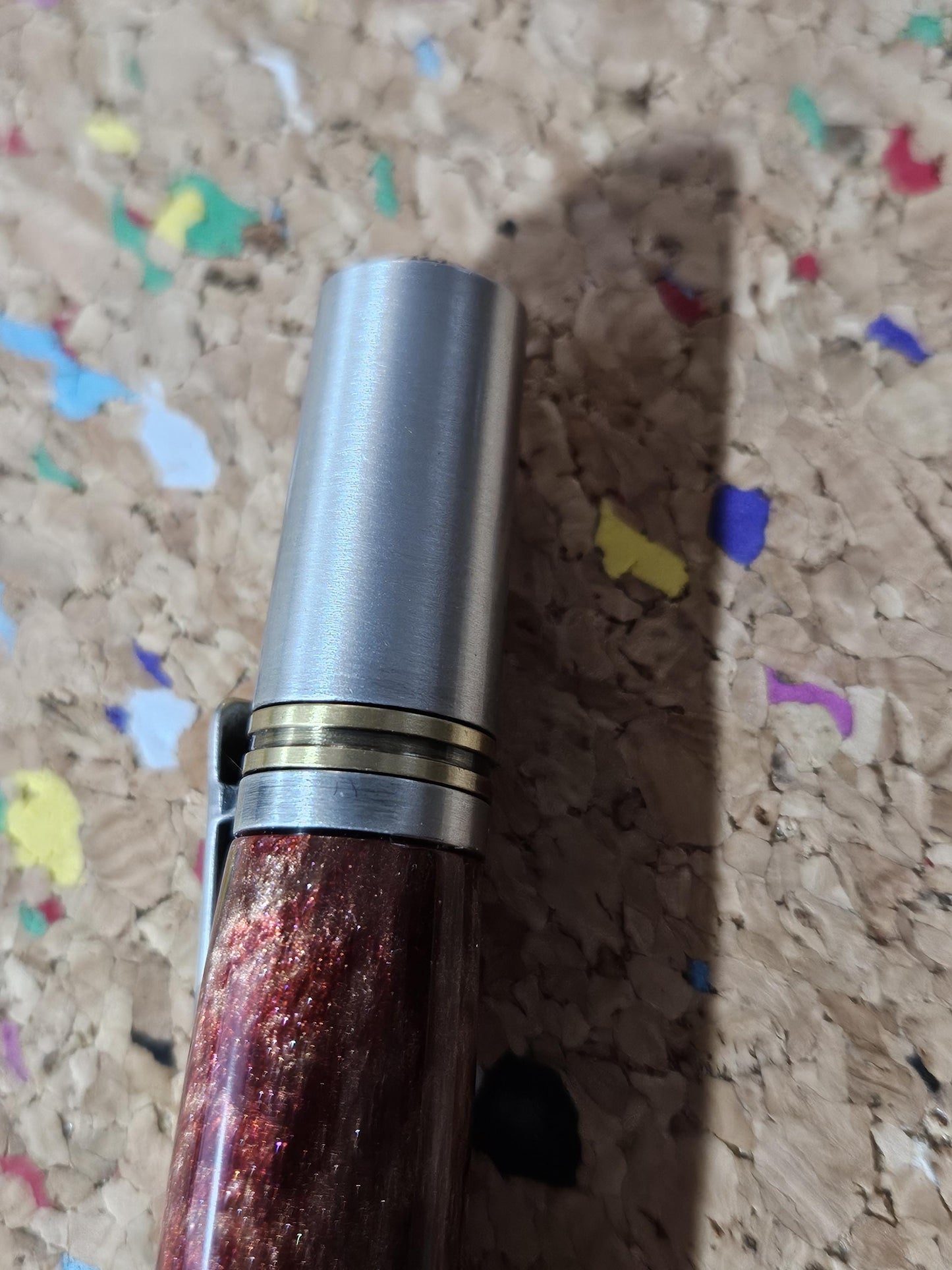 Red Swirled Resin Pen with Glitter and a Majestic Squire Pewter with an Antique Brass Pen Kit Adorned with a Zirconium Gem on the Clip