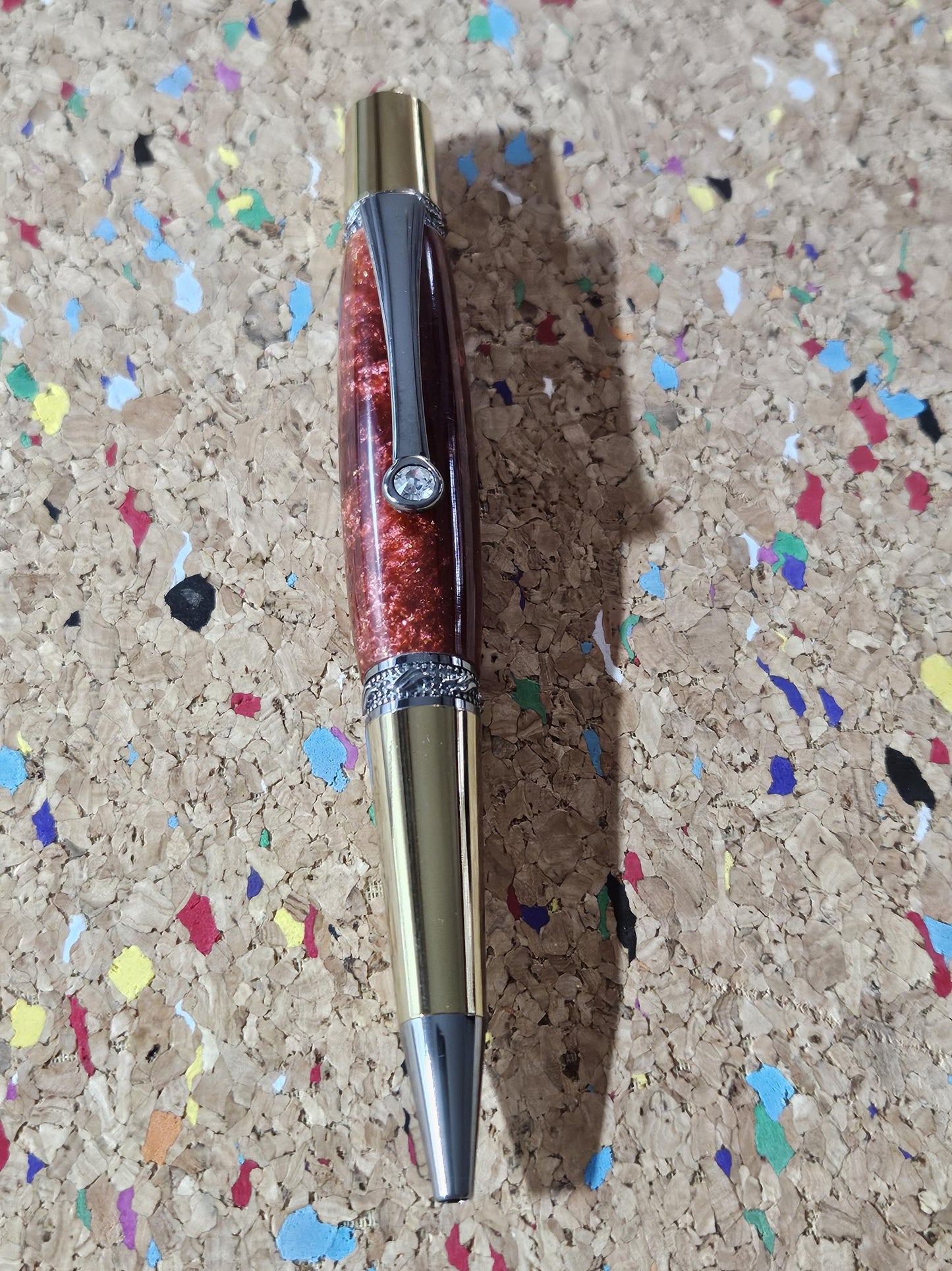 Red Swirled Resin Pen with Glitter and a Majestic Squire Inspired Gold Titanium and Rhodium Pen Kit with a Zirconium Gem on the Clip