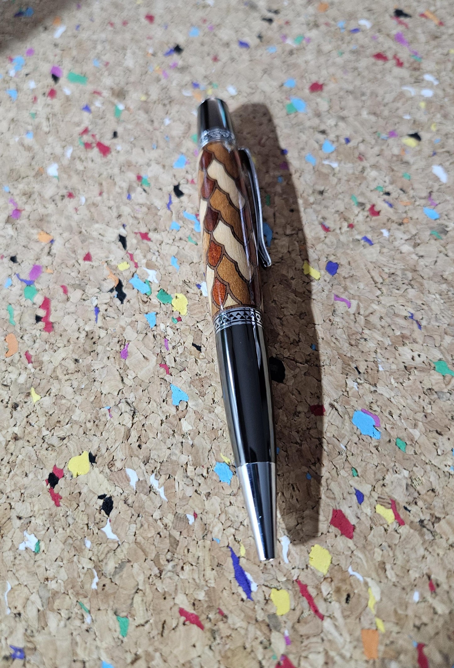 Cobb Brothers Scalloped Wooden Inlay Pen using Padauk, Mahogany, Maple, and Walnut Woods and Adorned with a Gunmetal and Chrome Pen Kit