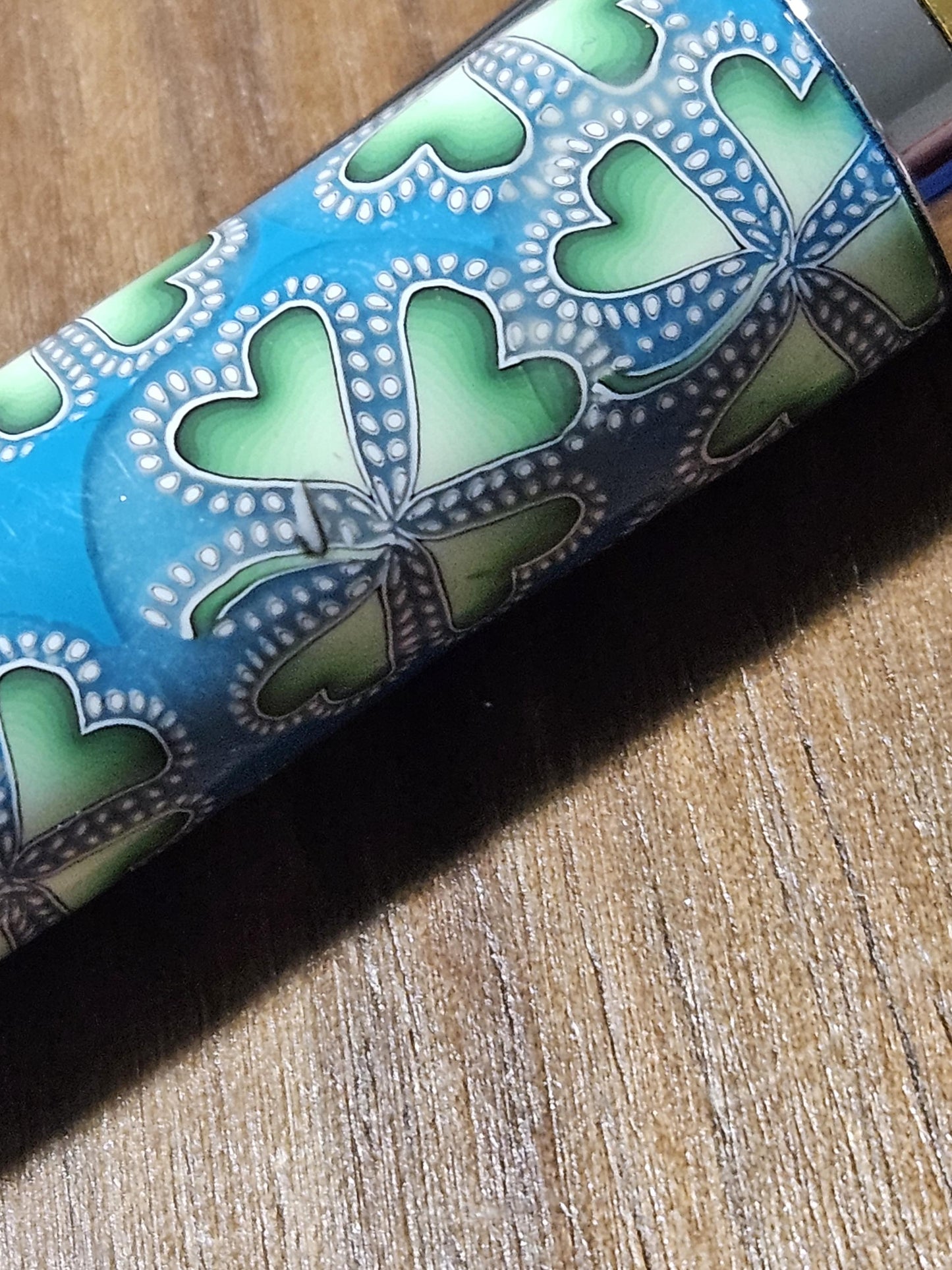 Polymer Clay Gnome Leprechaun Pen with Green Shamrocks, a Blue Background, Chrome and Gold Accents, and Featuring a Majestic Squire Pen Kit