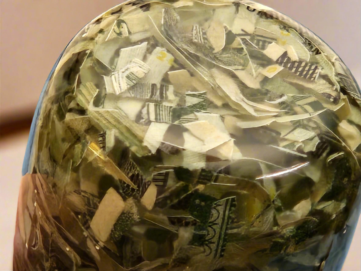 Bottle Stopper with Shredded Money Cast in Clear Resin with a Stainless Steel Bottle Stopper
