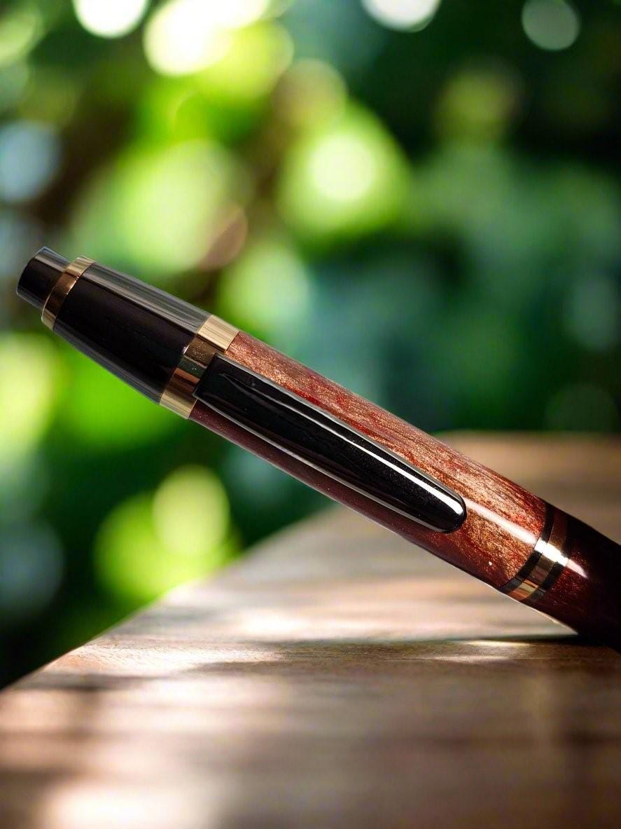 Penlight - LED Diamond Cast Red, Gold, and Brown Glittery Swirl Penlight with a Gunmetal Kit and Gold Accents