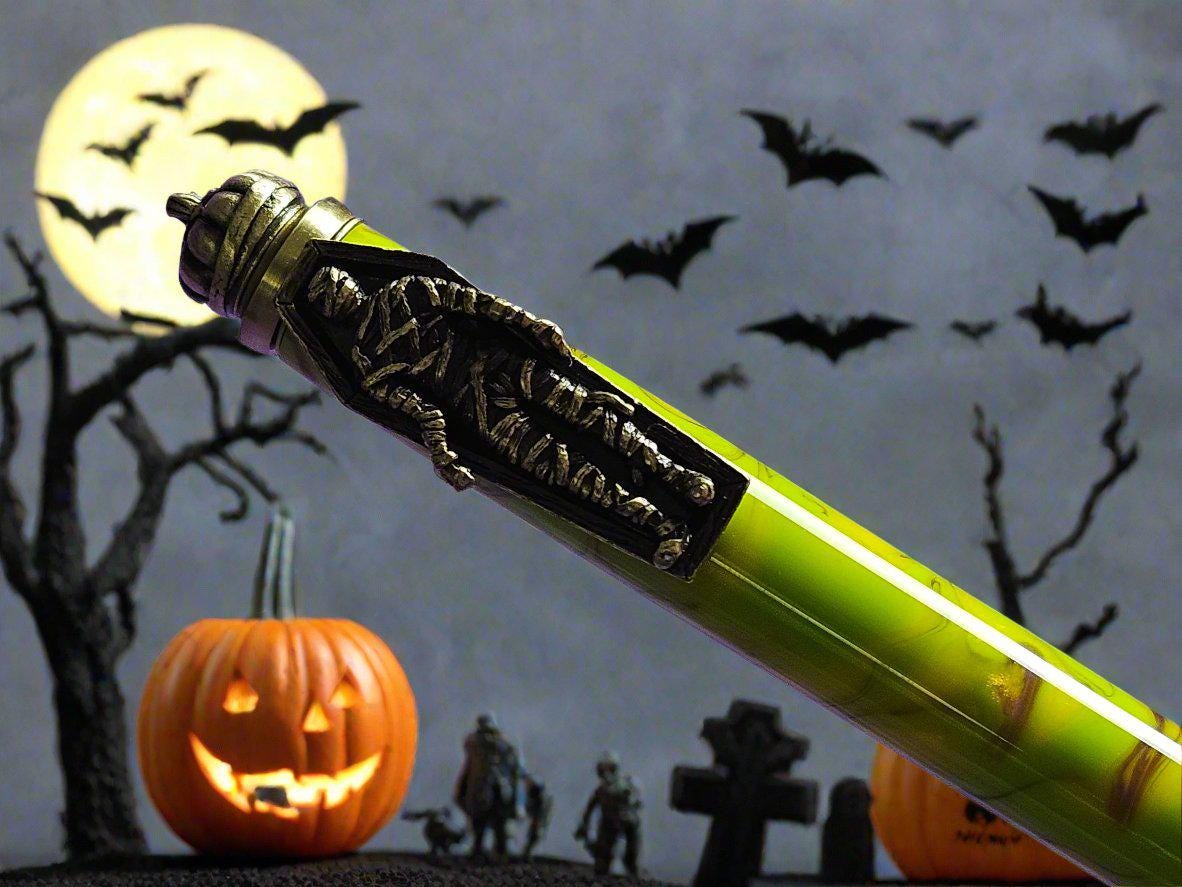 Haunted Halloween Yellow and Purple Resin Swirled Pen with a Gunmetal Halloween Pen Kit Featuring a Mummy, a Zombie, and a Jack-O-Lantern