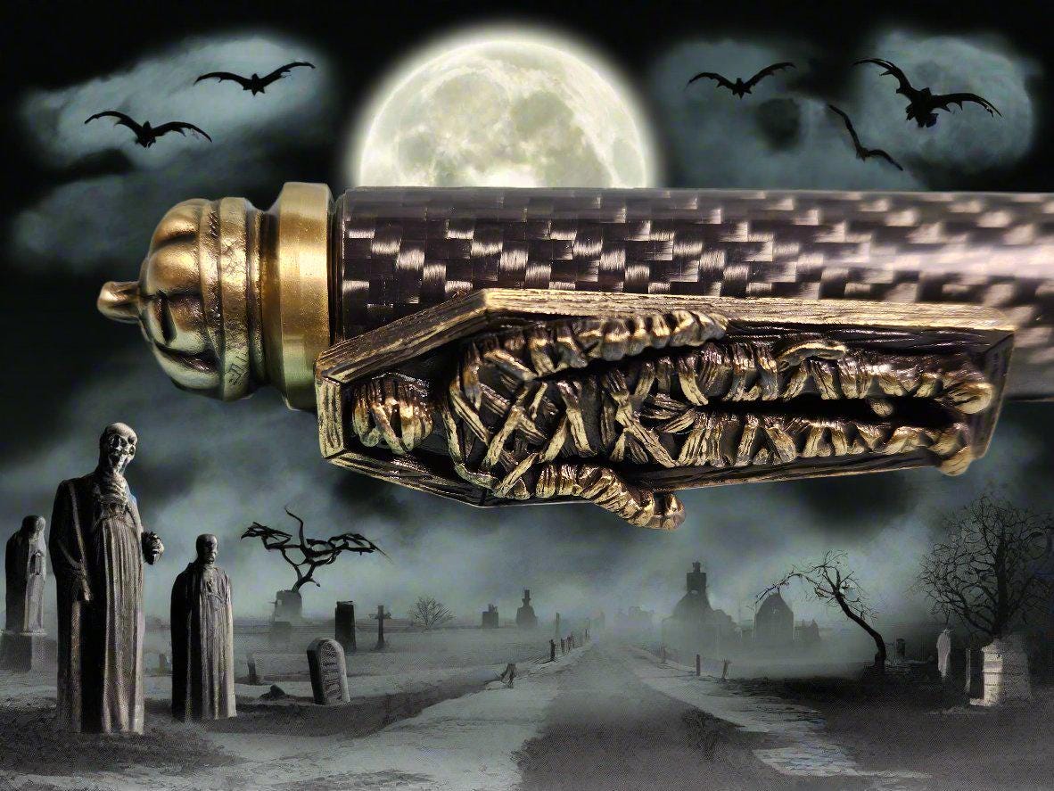 Haunted Halloween Carbon Fiber and Clear Resin Pen with an Antique Brass Halloween Pen Kit Featuring a Mummy, a Zombie, and a Jack-O-Lantern
