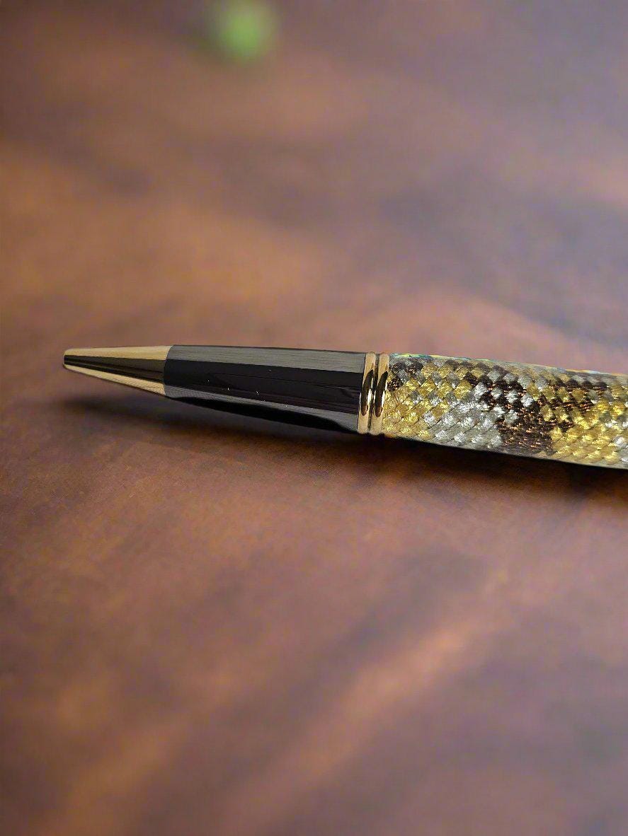 Gold, Silver, and Brown Metallic Braided Carbon Fiber Sleeve Pen Cast in Resin with Gold and Black Chrome and a Hint of Green in the Pen Kit