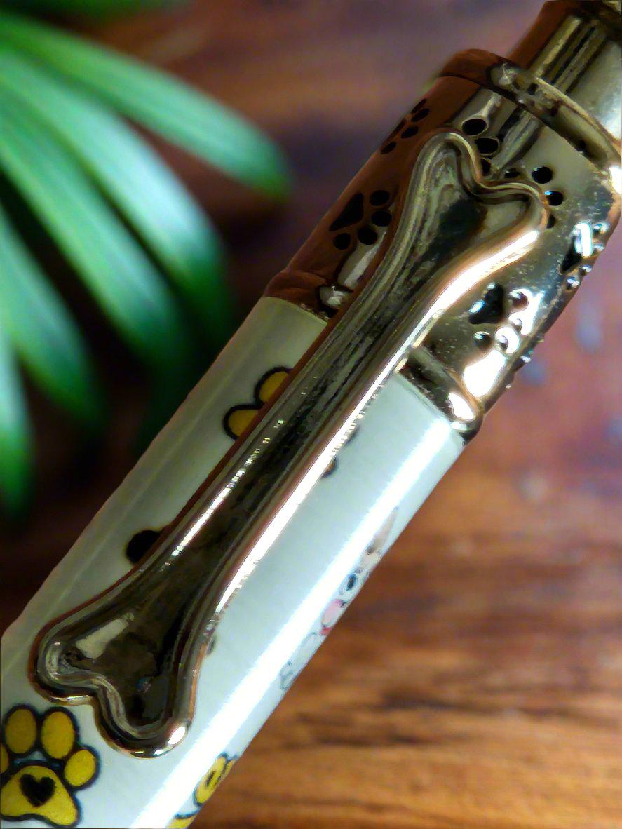 My Dog Loves Me Pen with a Gold Click Top Featuring a Dog Bone, a Dog Bowl, and Doggie Paw Prints