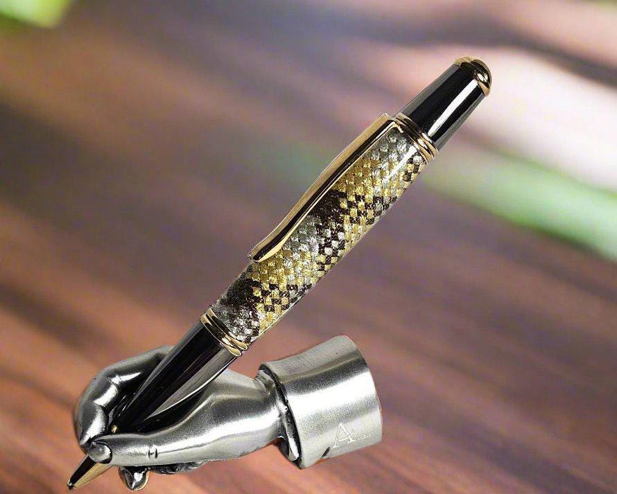 Gold, Silver, and Brown Metallic Braided Carbon Fiber Sleeve Pen Cast in Resin with Gold and Black Chrome and a Hint of Green in the Pen Kit