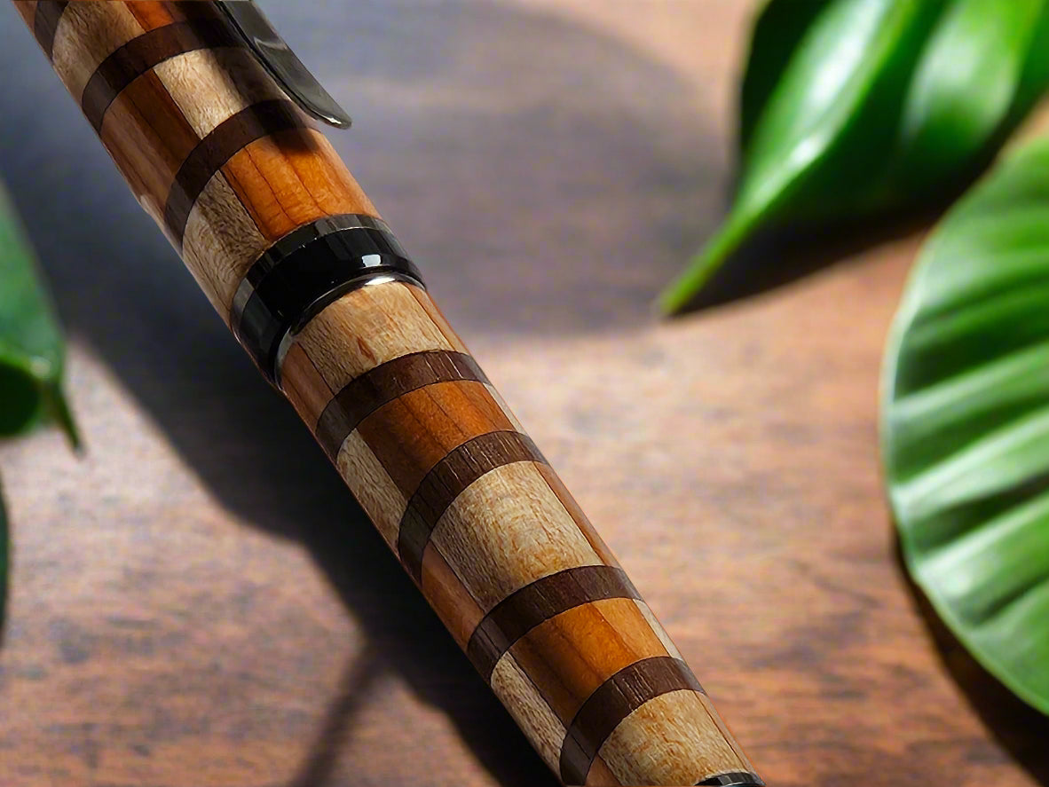 Segmented Wooden Pen, handcrafted from Cherry, Maple, and Walnut with a Gunmetal Pen Kit and Sleek Black Accents
