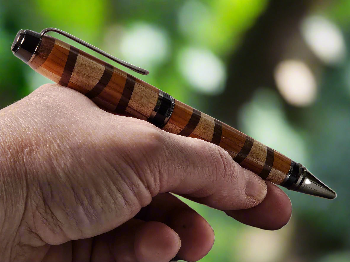 Segmented Wooden Pen, handcrafted from Cherry, Maple, and Walnut with a Gunmetal Pen Kit and Sleek Black Accents