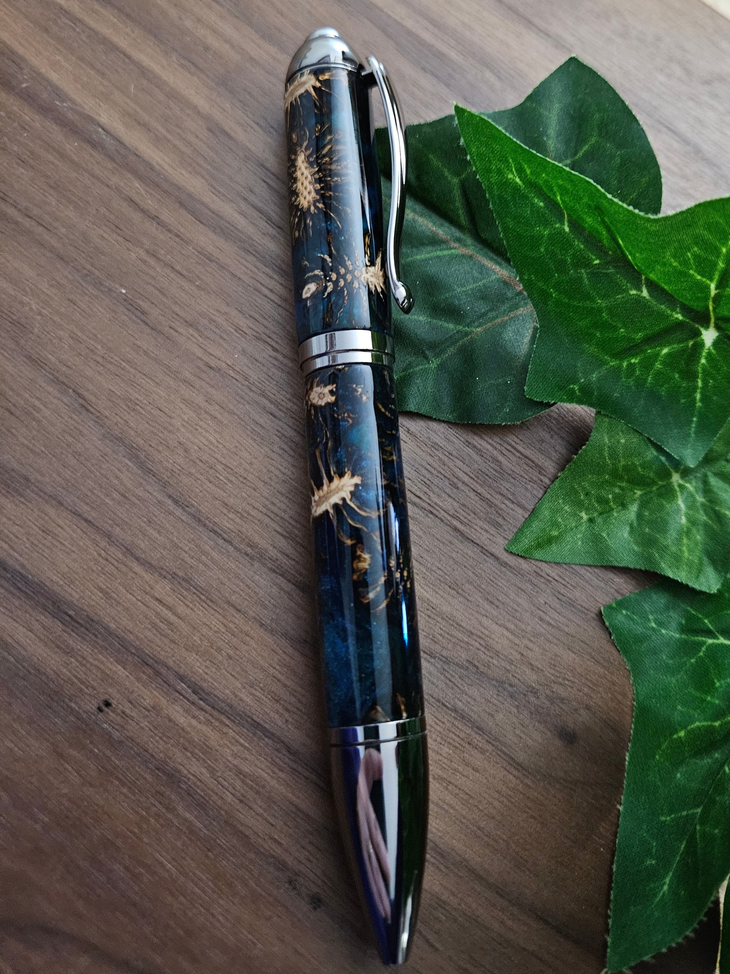 Hybrid Metier Twist Ballpoint Pen with a Red Laser Pointer, Dark Blue Resin, and Pinecone Embeds with a Gunmetal Finish