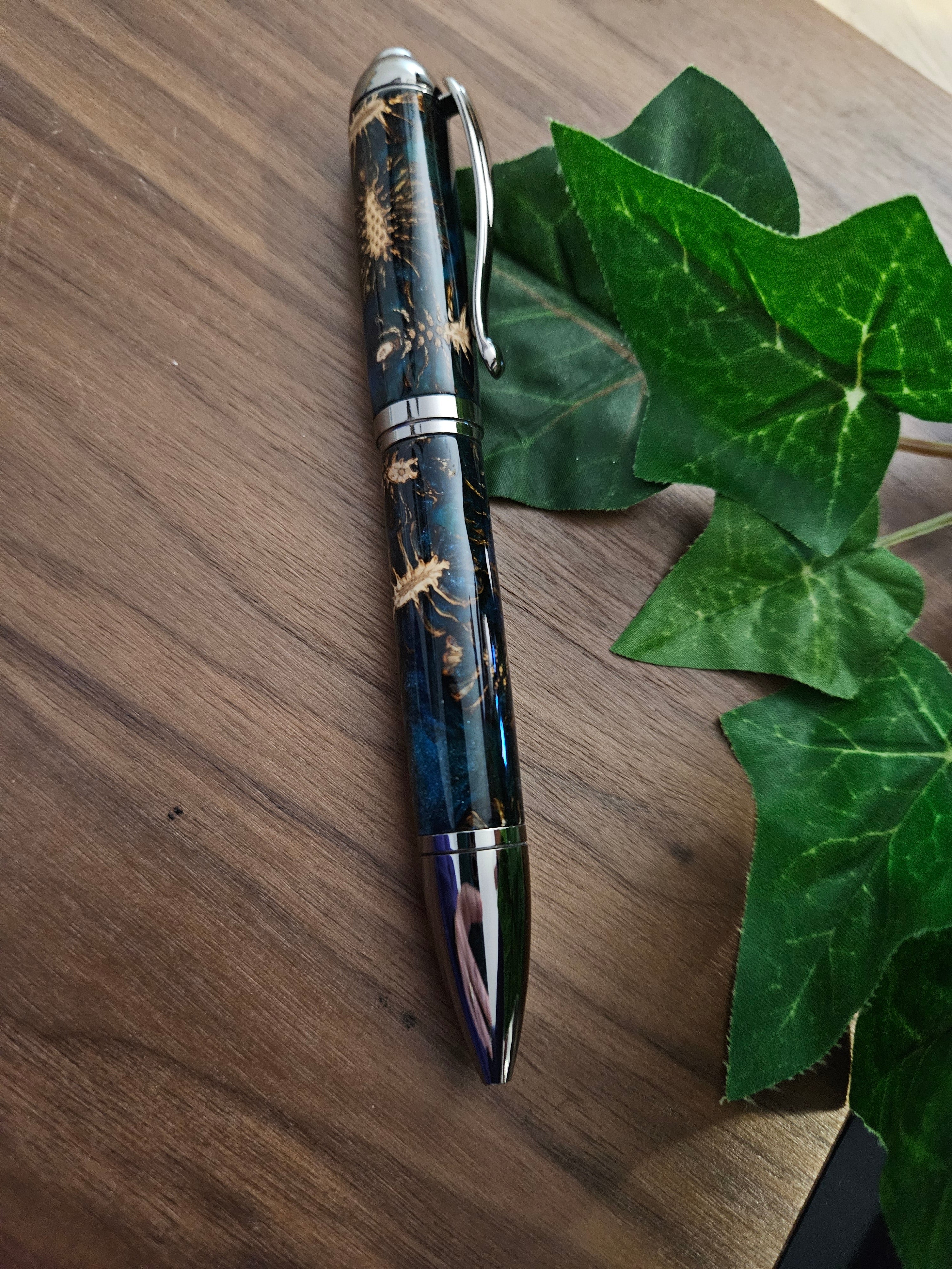 Hybrid Metier Twist Ballpoint Pen with a Red Laser Pointer, Dark Blue Resin, and Pinecone Embeds with a Gunmetal Finish