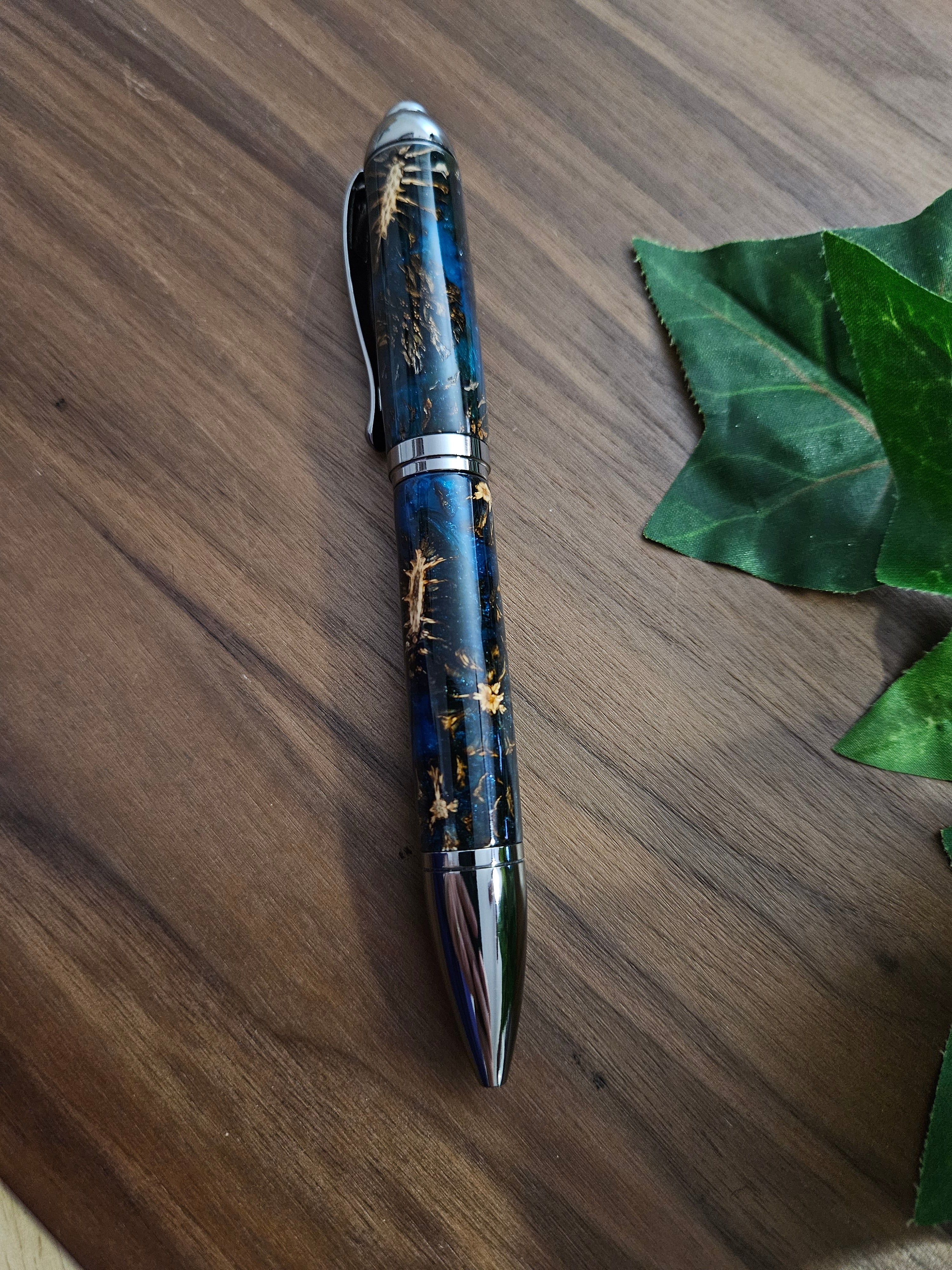 Hybrid Metier Twist Ballpoint Pen with a Red Laser Pointer, Dark Blue Resin, and Pinecone Embeds with a Gunmetal Finish
