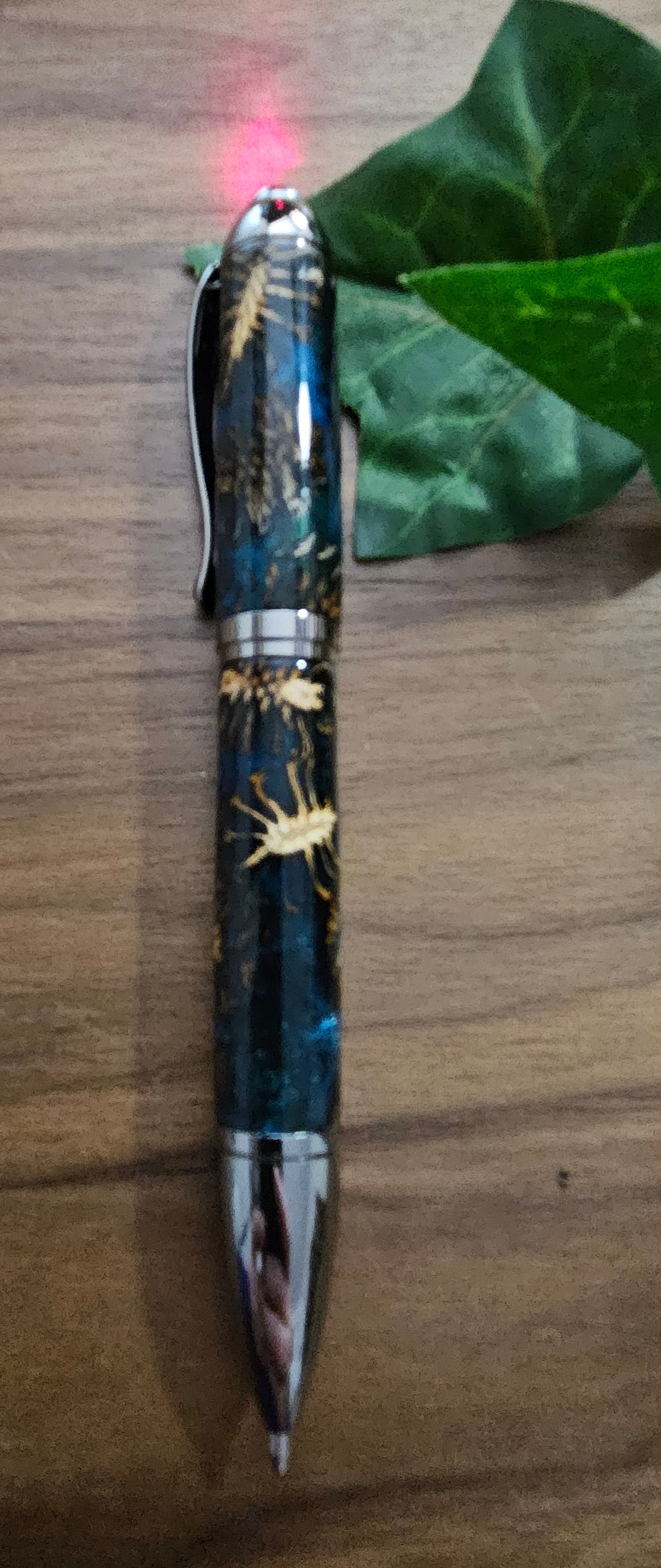 Hybrid Metier Twist Ballpoint Pen with a Red Laser Pointer, Dark Blue Resin, and Pinecone Embeds with a Gunmetal Finish