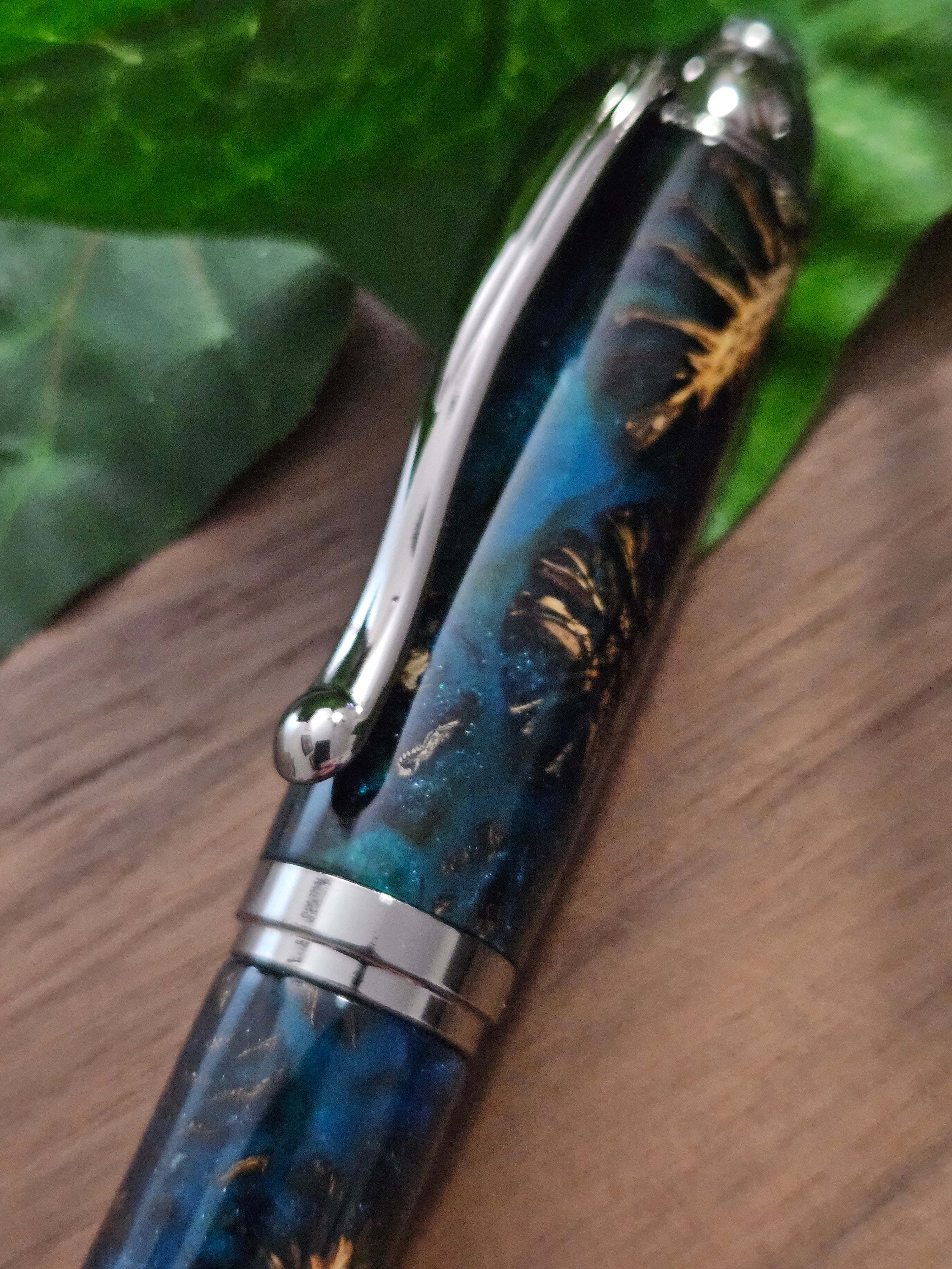 Hybrid Metier Twist Ballpoint Pen with a Red Laser Pointer, Dark Blue Resin, and Pinecone Embeds with a Gunmetal Finish