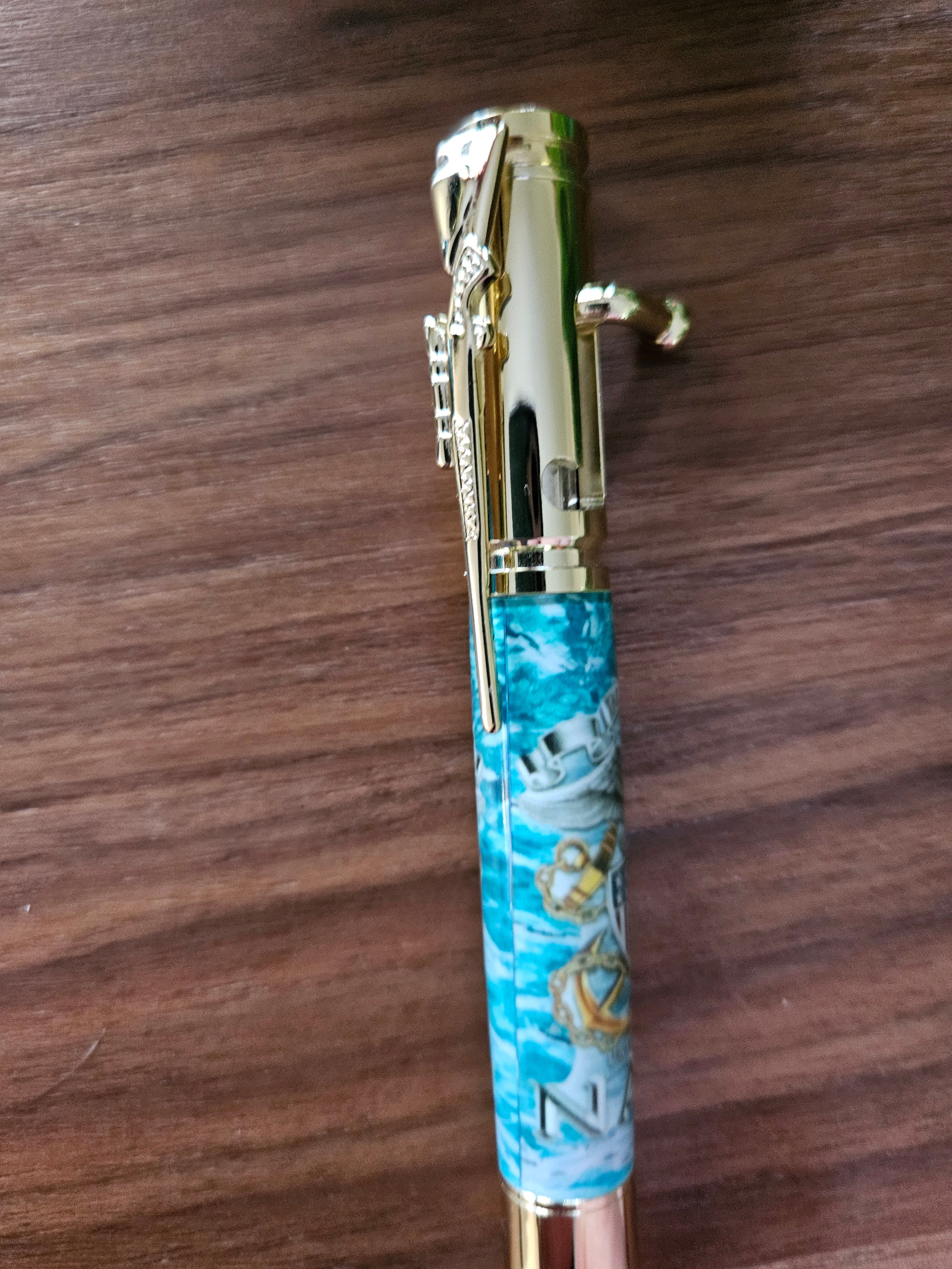 The Sea is Ours - Navy Emblem Label Cast Pen - Teal Background with a Gold Pen Kit Featuring a Rifle Pen Clip