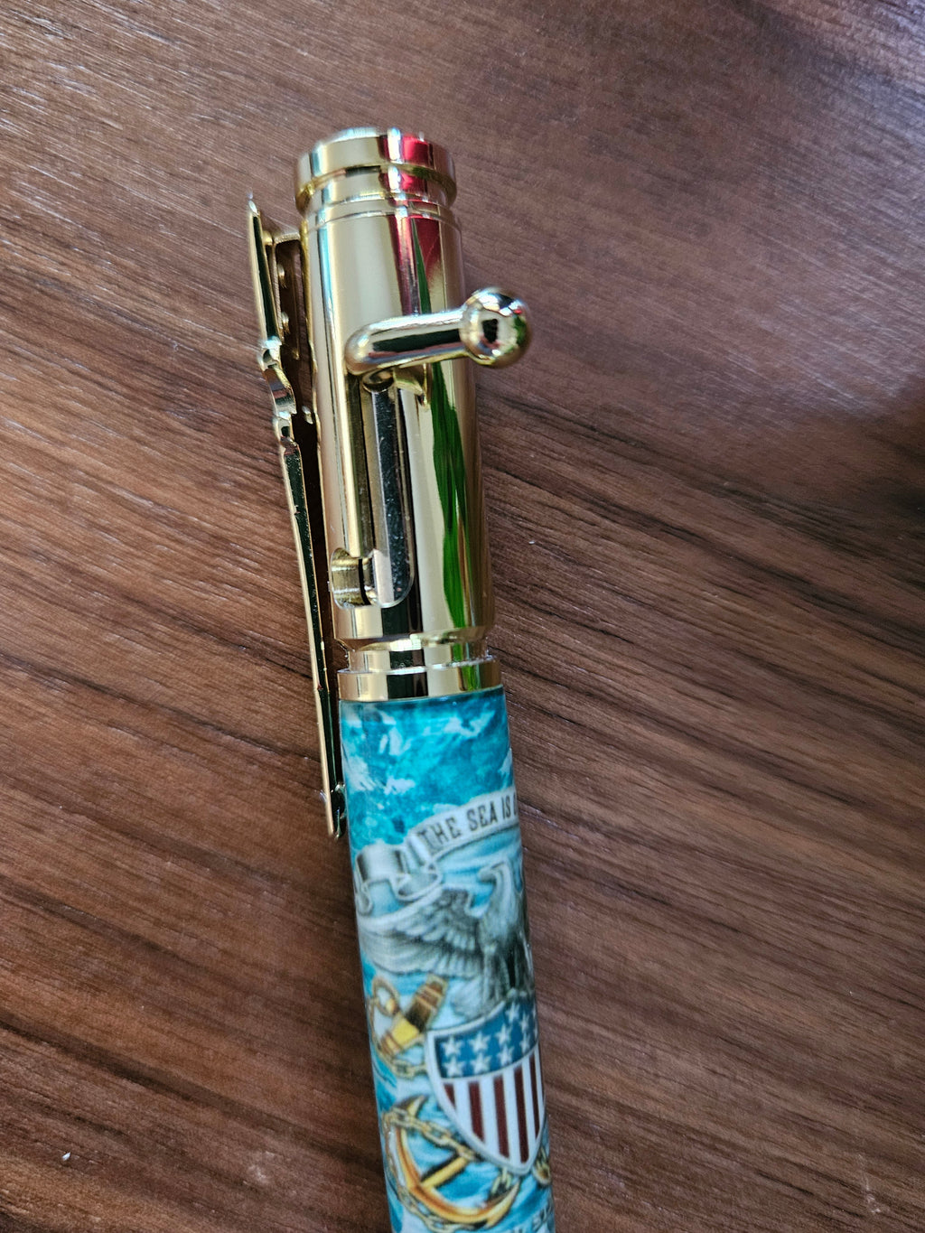 The Sea is Ours - Navy Emblem Label Cast Pen - Teal Background with a Gold Pen Kit Featuring a Rifle Pen Clip