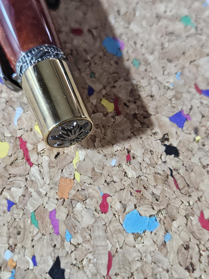 Red Swirled Resin Pen with Glitter and a Majestic Squire Inspired Gold Titanium and Rhodium Pen Kit with a Zirconium Gem on the Clip