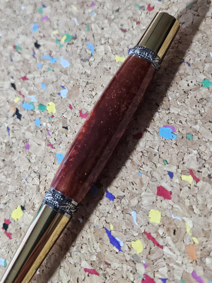 Red Swirled Resin Pen with Glitter and a Majestic Squire Inspired Gold Titanium and Rhodium Pen Kit with a Zirconium Gem on the Clip