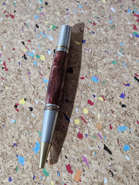 Red Swirled Resin Pen with Glitter and a Majestic Squire Pewter with an Antique Brass Pen Kit Adorned with a Zirconium Gem on the Clip