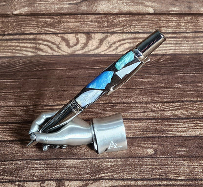Pearlized Chips of Resin: Blue, Green, White, and Violet Contrasting with a Black Base and a Black Titanium and Chrome Pen Kit