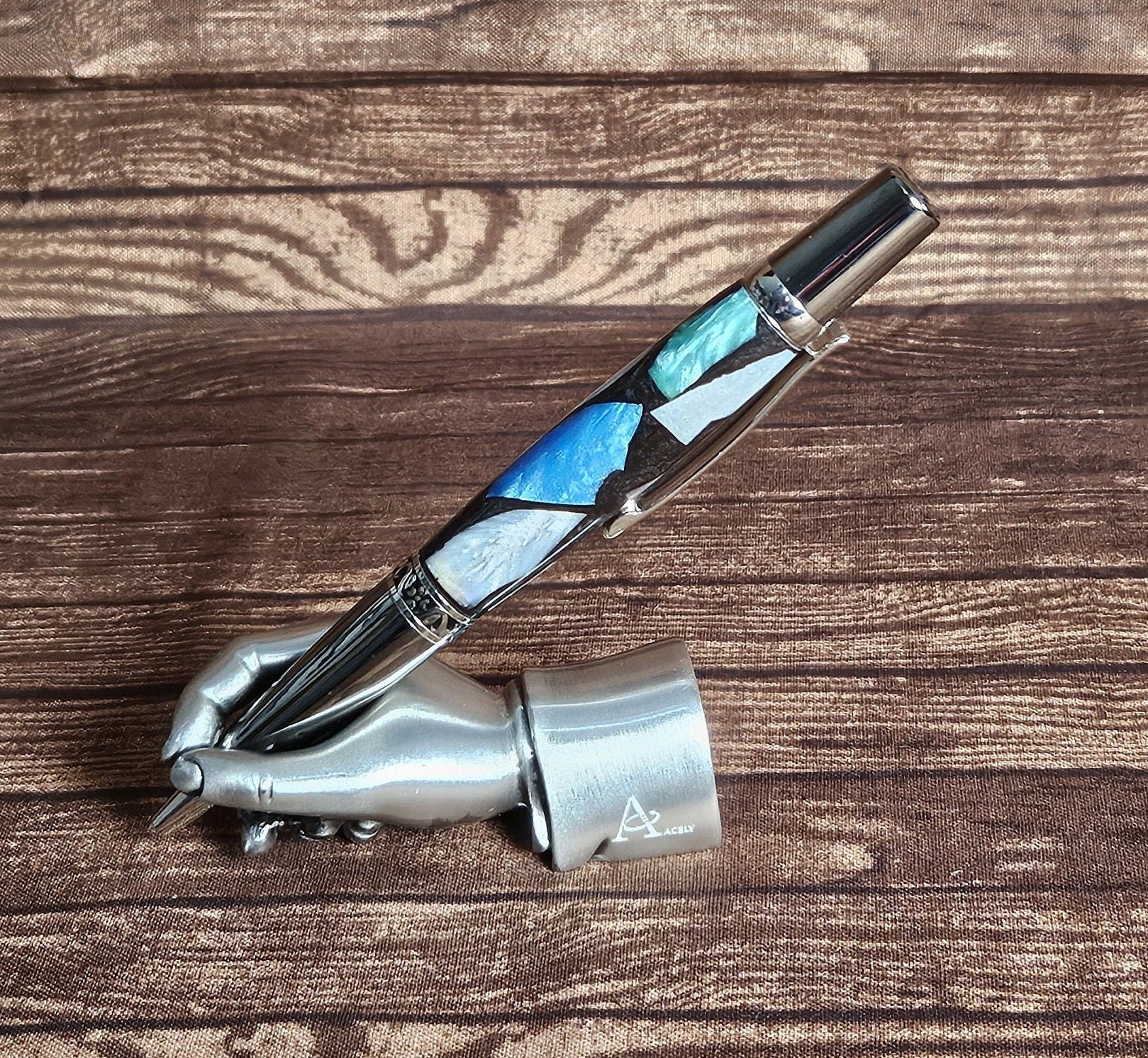 Pearlized Chips of Resin: Blue, Green, White, and Violet Contrasting with a Black Base and a Black Titanium and Chrome Pen Kit
