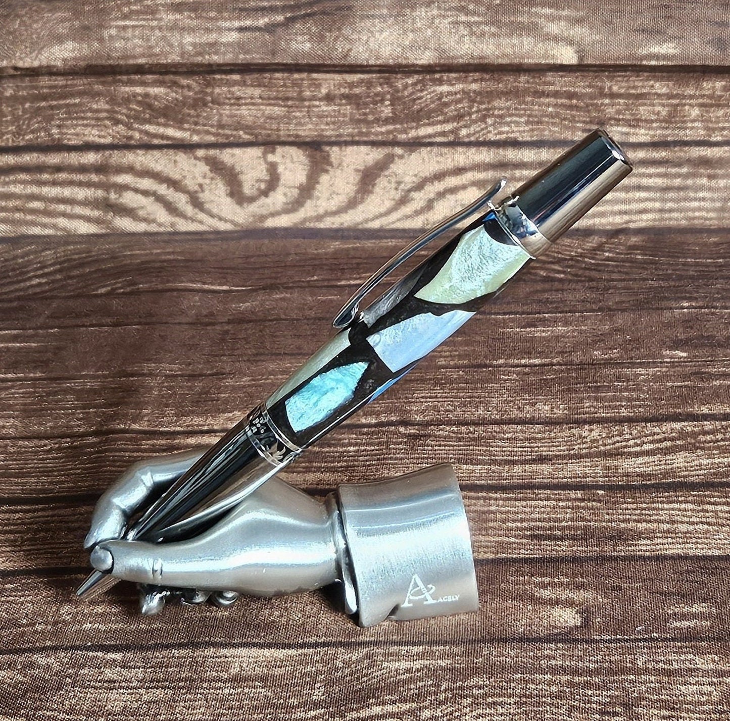 Pearlized Chips of Resin: Blue, Green, White, and Violet Contrasting with a Black Base and a Black Titanium and Chrome Pen Kit