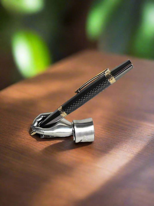 Flat Topped Black Carbon Fiber Sleeve Pen Cast in Resin with a Gold and Gunmetal Pen Kit