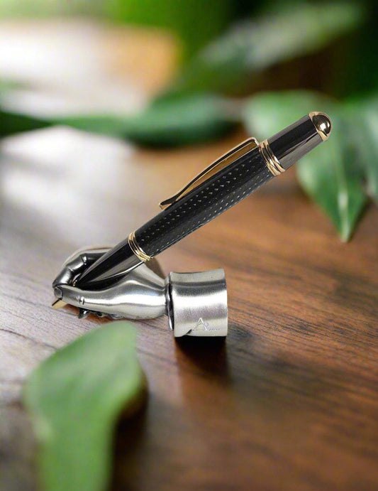 Round Top Black Carbon Fiber Sleeve Pen Cast in Resin with a Gold and Gunmetal Pen Kit