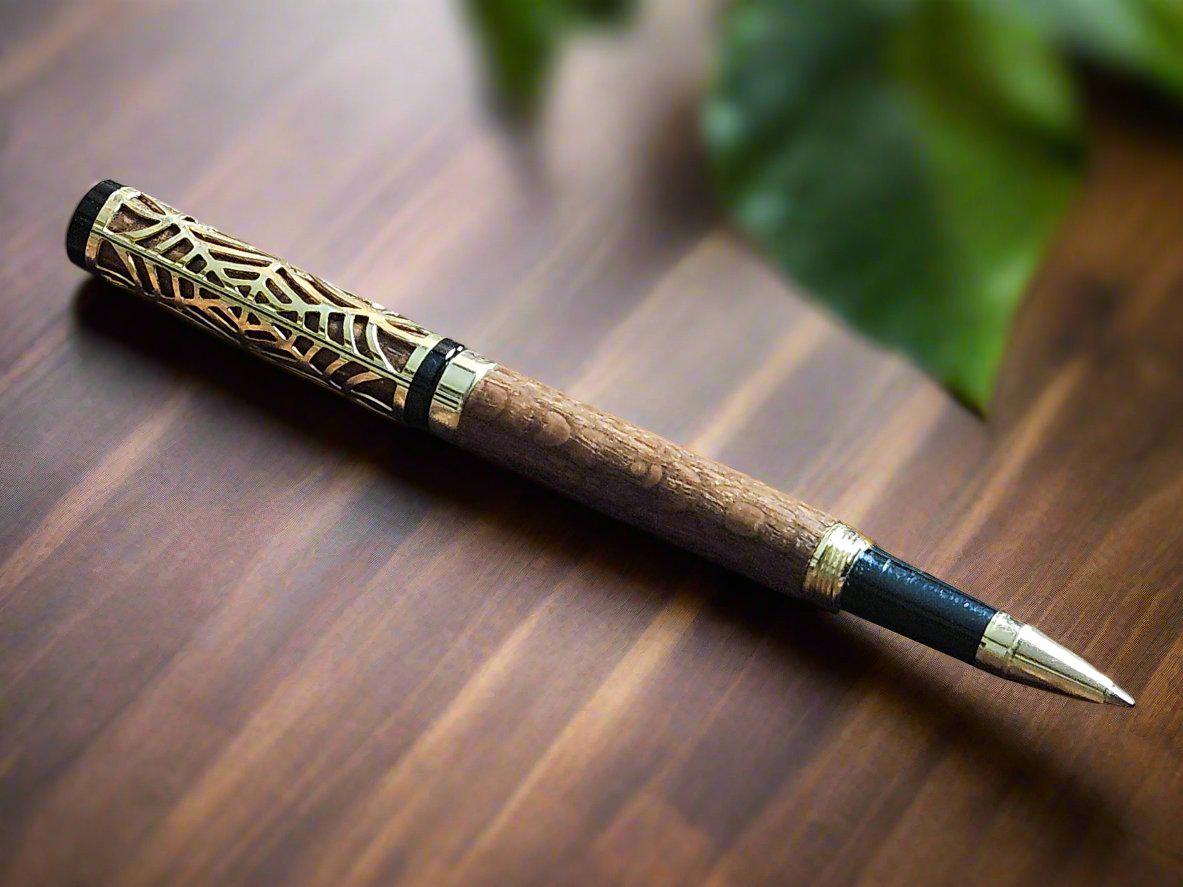 Haunted Halloween Lacewood Capped Ballpoint Pen with a Golden Spider Web overlay and a Gold and Black Chrome Pen Kit