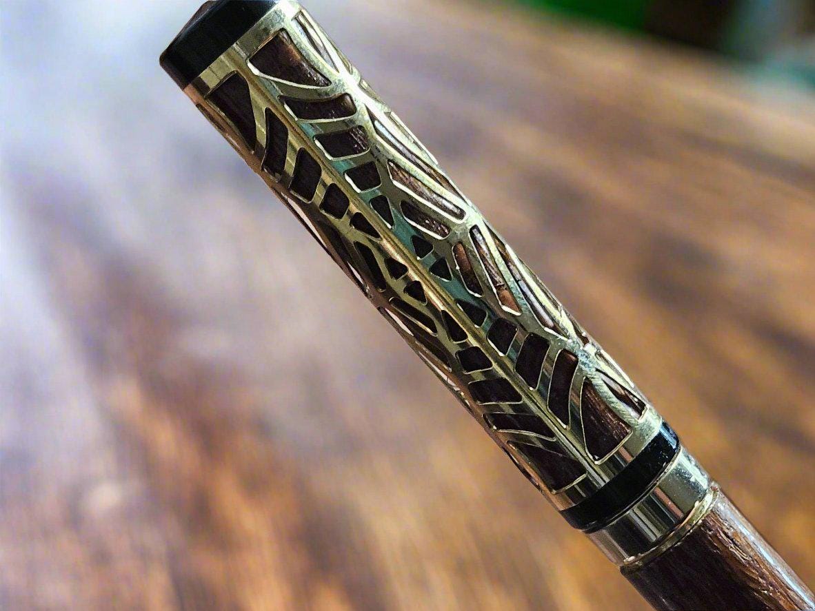 Haunted Halloween Lacewood Capped Rollerball Pen with a Golden Spider Web overlay and a Gold and Black Chrome Pen Kit