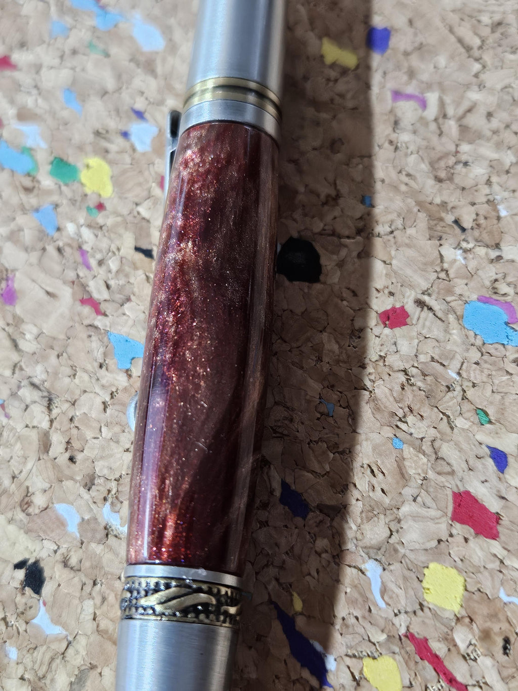 Red Swirled Resin Pen with Glitter and a Majestic Squire Pewter with an Antique Brass Pen Kit Adorned with a Zirconium Gem on the Clip