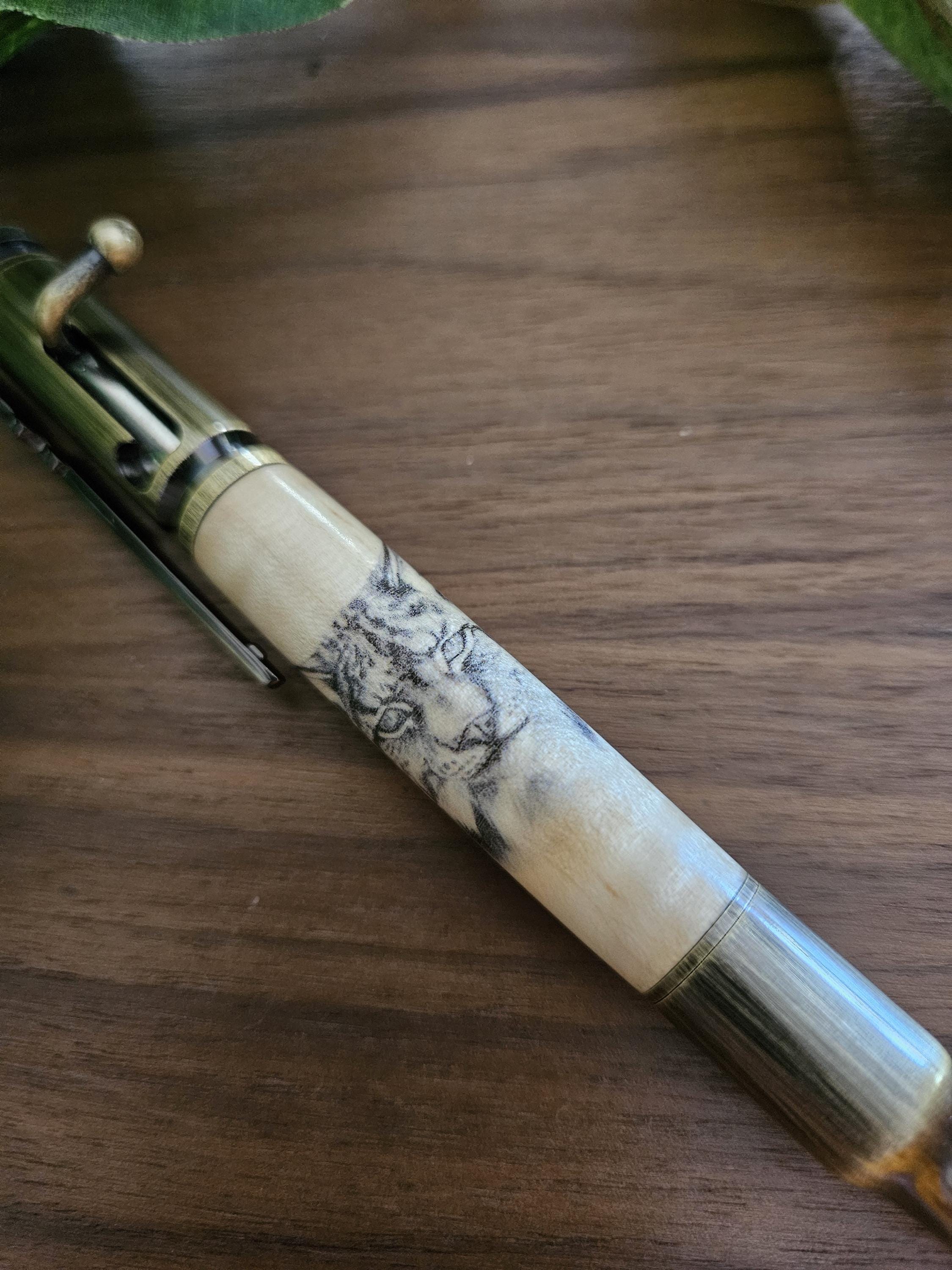 Wooden Bobcat Decal Pen on Curly Maple with a Brushed Antique Brass Bolt Action Rifle Pen Kit