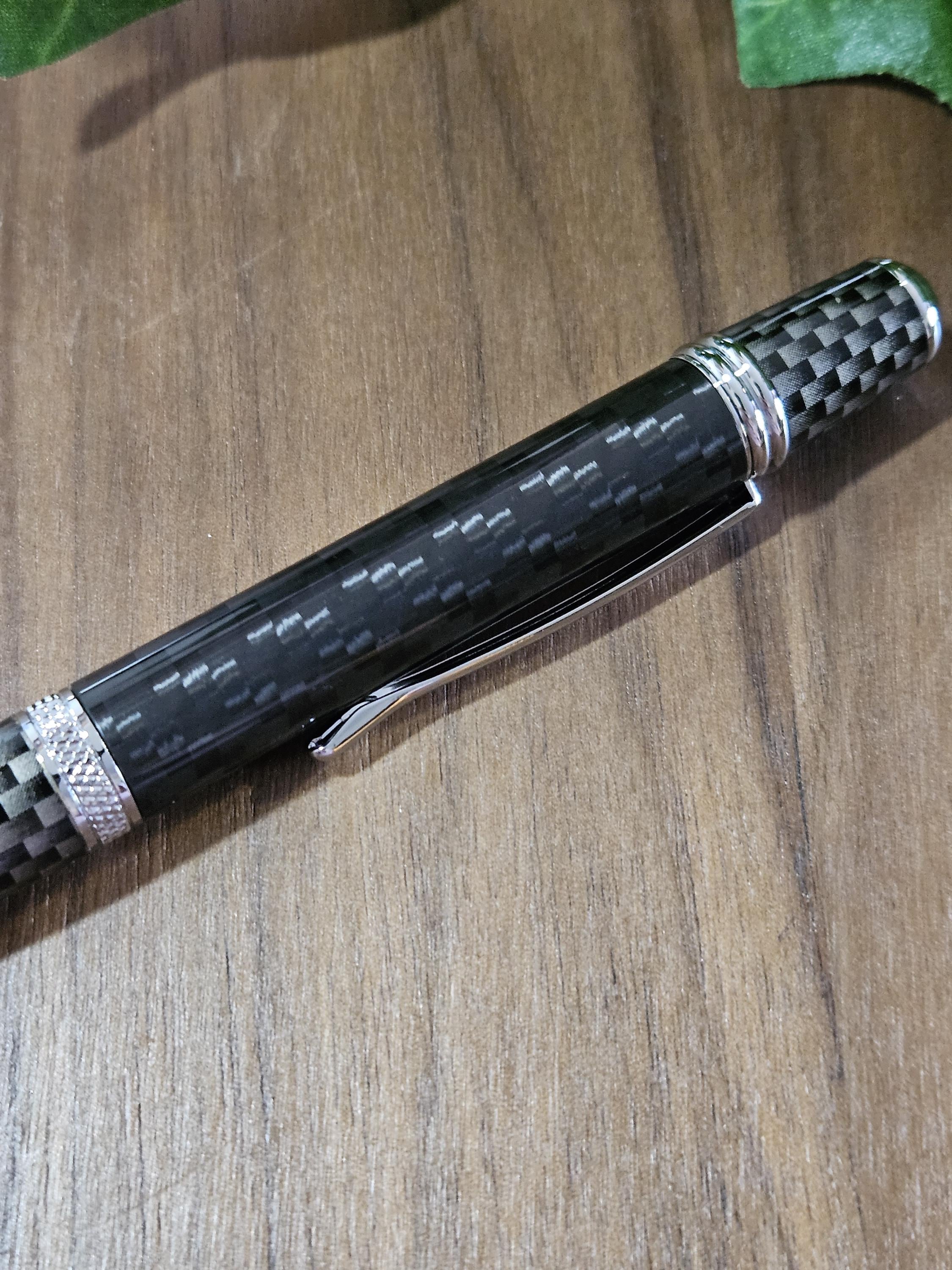 Shades of Black Carbon Fiber Cast in Clear Resin Twist Pen with Faux Carbon Fiber Finial and Tapered Grip with Chrome Accents