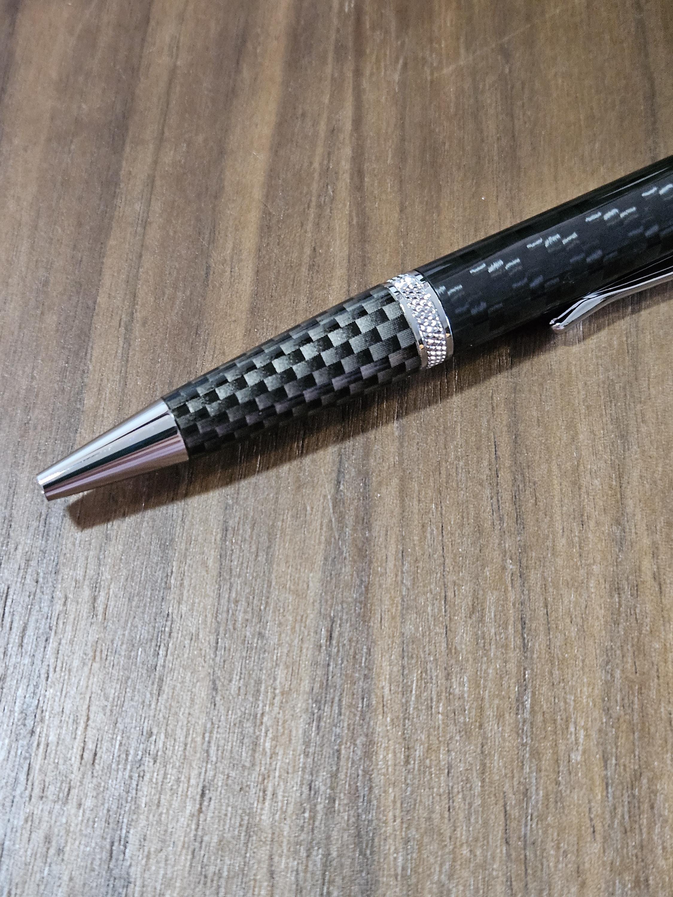 Shades of Black Carbon Fiber Cast in Clear Resin Twist Pen with Faux Carbon Fiber Finial and Tapered Grip with Chrome Accents
