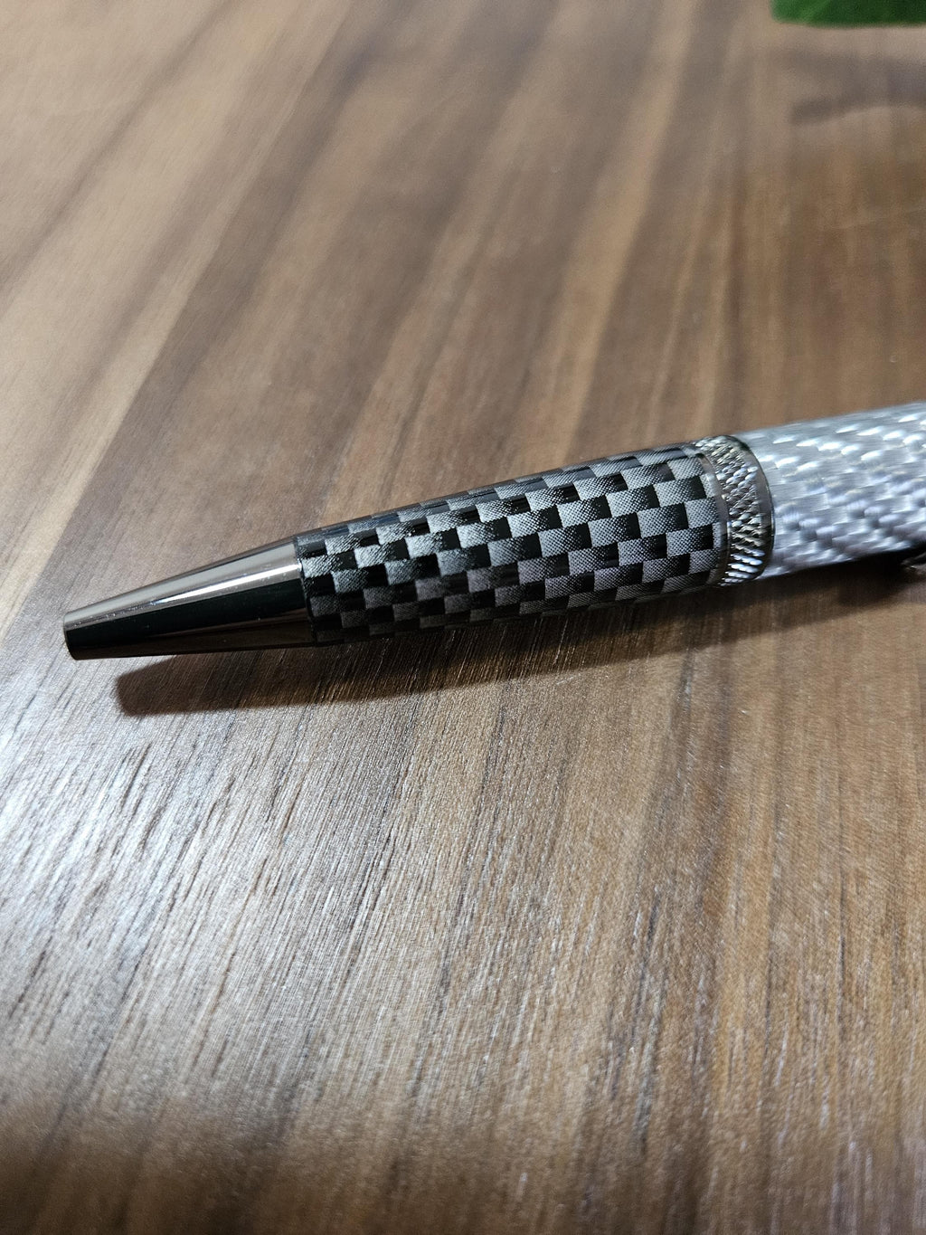 Shades of Silver Carbon Fiber Cast in Clear Resin Twist Pen with Faux Carbon Fiber Finial and Tapered Grip with Gunmetal Accents