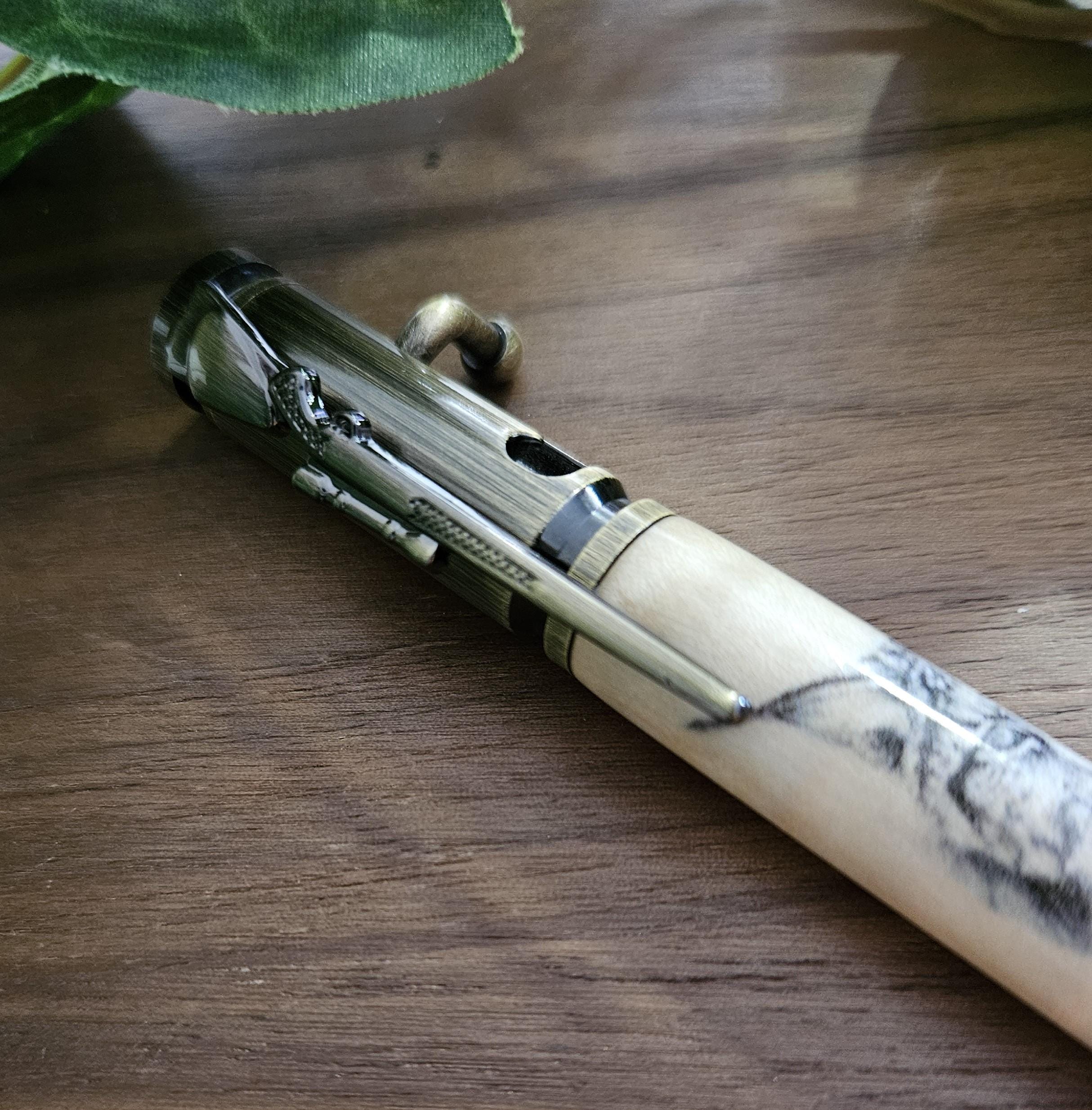 Wooden Bobcat Decal Pen on Curly Maple with a Brushed Antique Brass Bolt Action Rifle Pen Kit