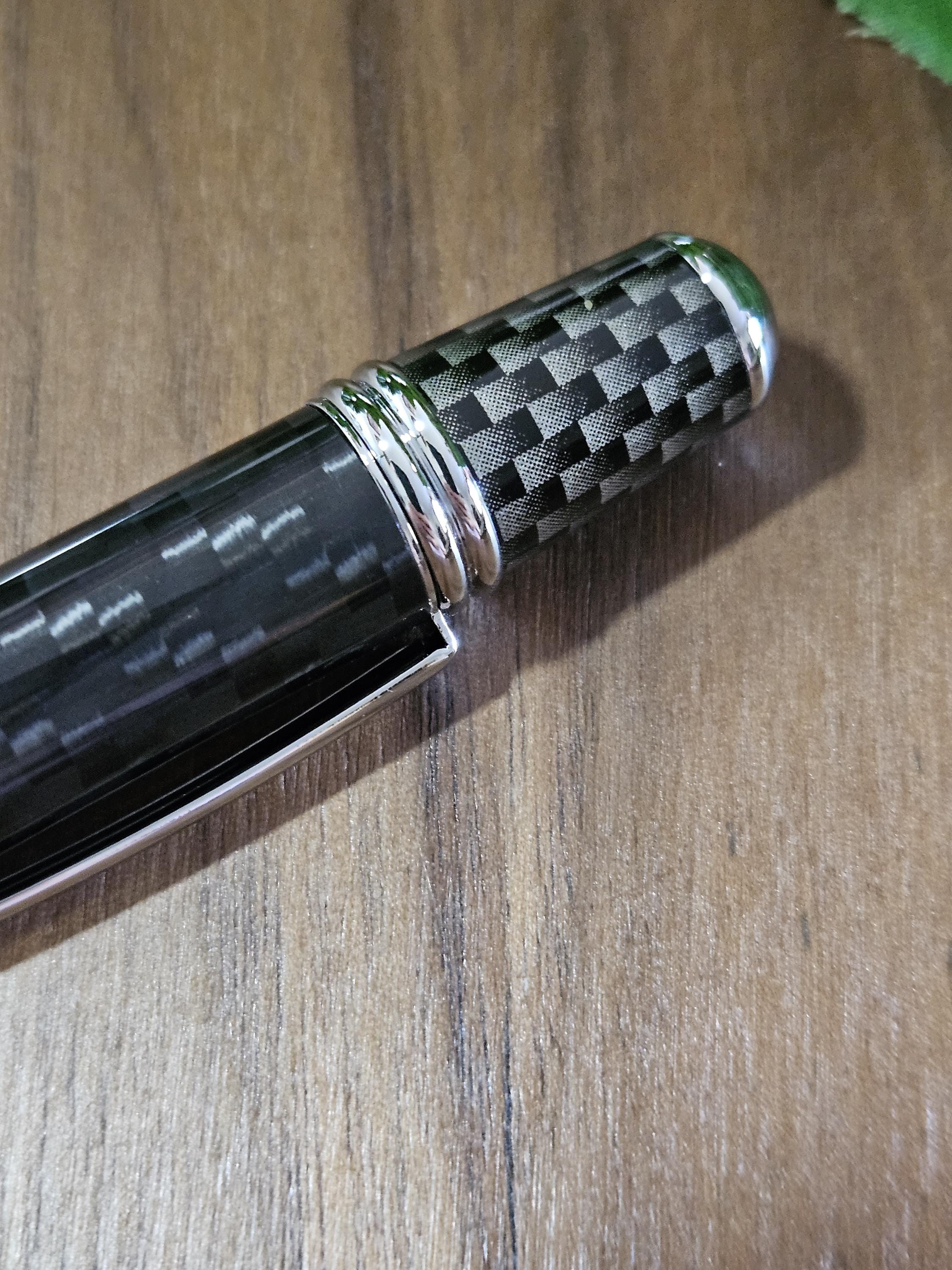 Shades of Black Carbon Fiber Cast in Clear Resin Twist Pen with Faux Carbon Fiber Finial and Tapered Grip with Chrome Accents