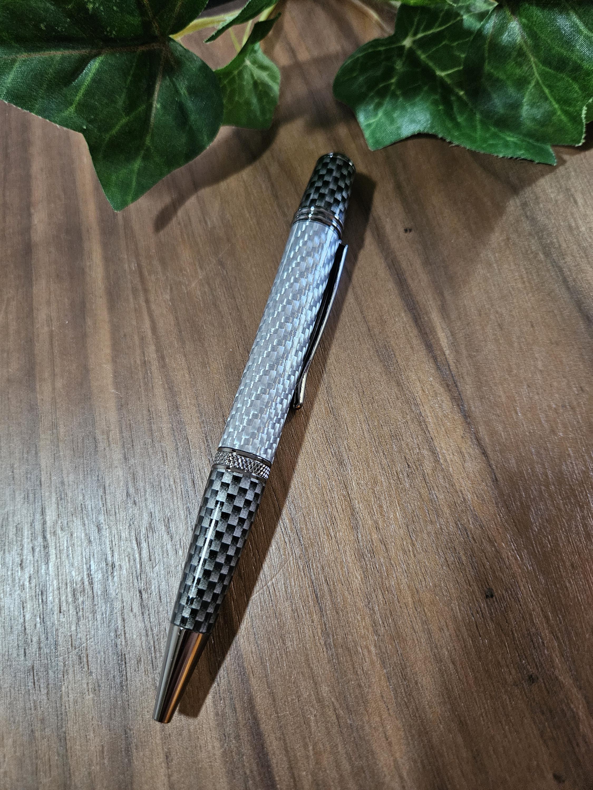 Shades of Silver Carbon Fiber Cast in Clear Resin Twist Pen with Faux Carbon Fiber Finial and Tapered Grip with Gunmetal Accents