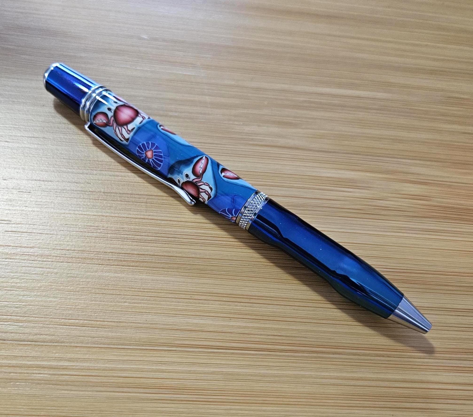 Refillable Polymer Clay Twist Pen, True Texture, Blue Titanium & Chrome Accents, Crab Pattern, Red and Blue Colored Body, Medium Tip, 1.7 oz